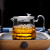 Wholesale 550ml Heat Resistant Glass Teapot with Tea Strainer and Colorful Handle