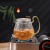 China Supplier 600ML High Borosilicate Handmade Glass Teapot with Color Handle